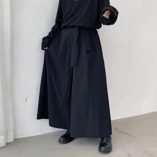 Wide leg black hakama pants – front panel drape detail – side view