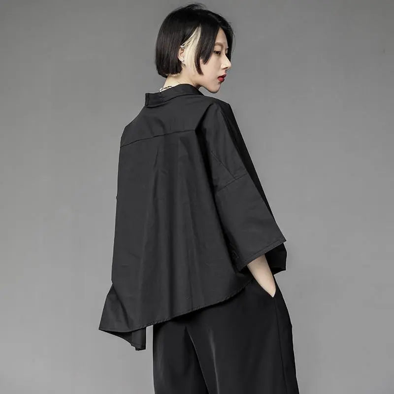 Japanese minimalist oversized shirt – asymmetric hem – back three-quarter view